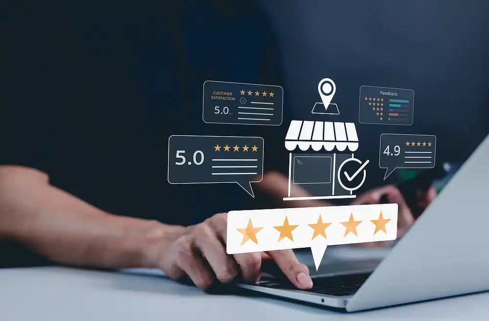 Laptop and graphic of 5-star ratings showing how a business email address boost credibility